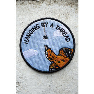 Hanging By a Thread Iron On Patch